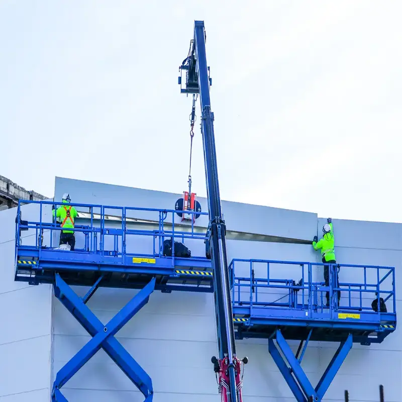 Scissor Lifts Working with Cladding in Leeds