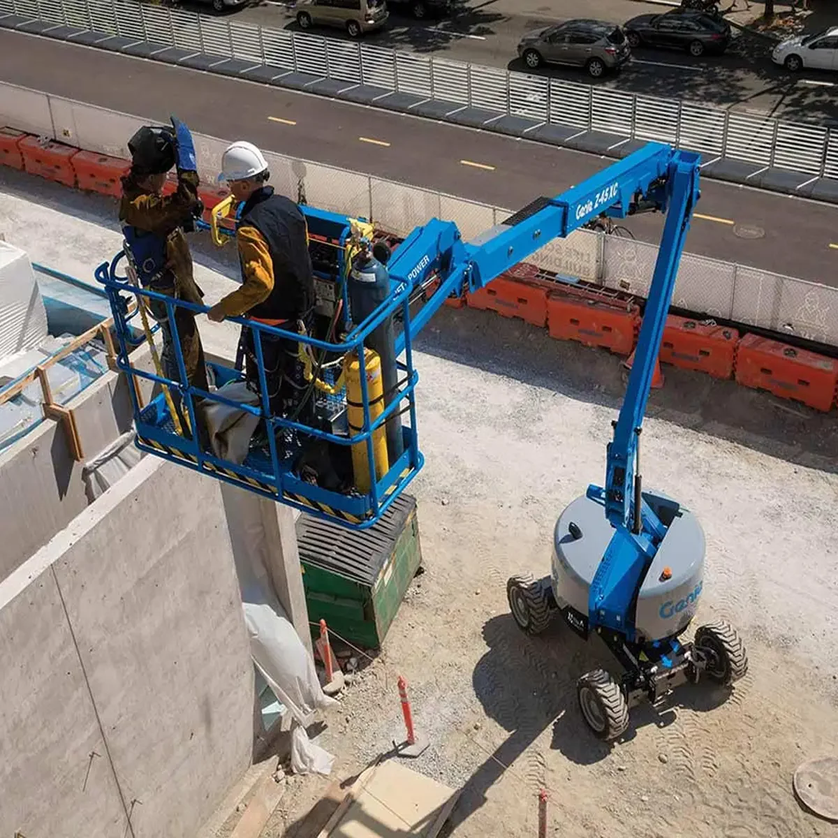 Z-45-XC-Articulated-Boom-Lift-2-people-on-platform-at-height-on-construction-site